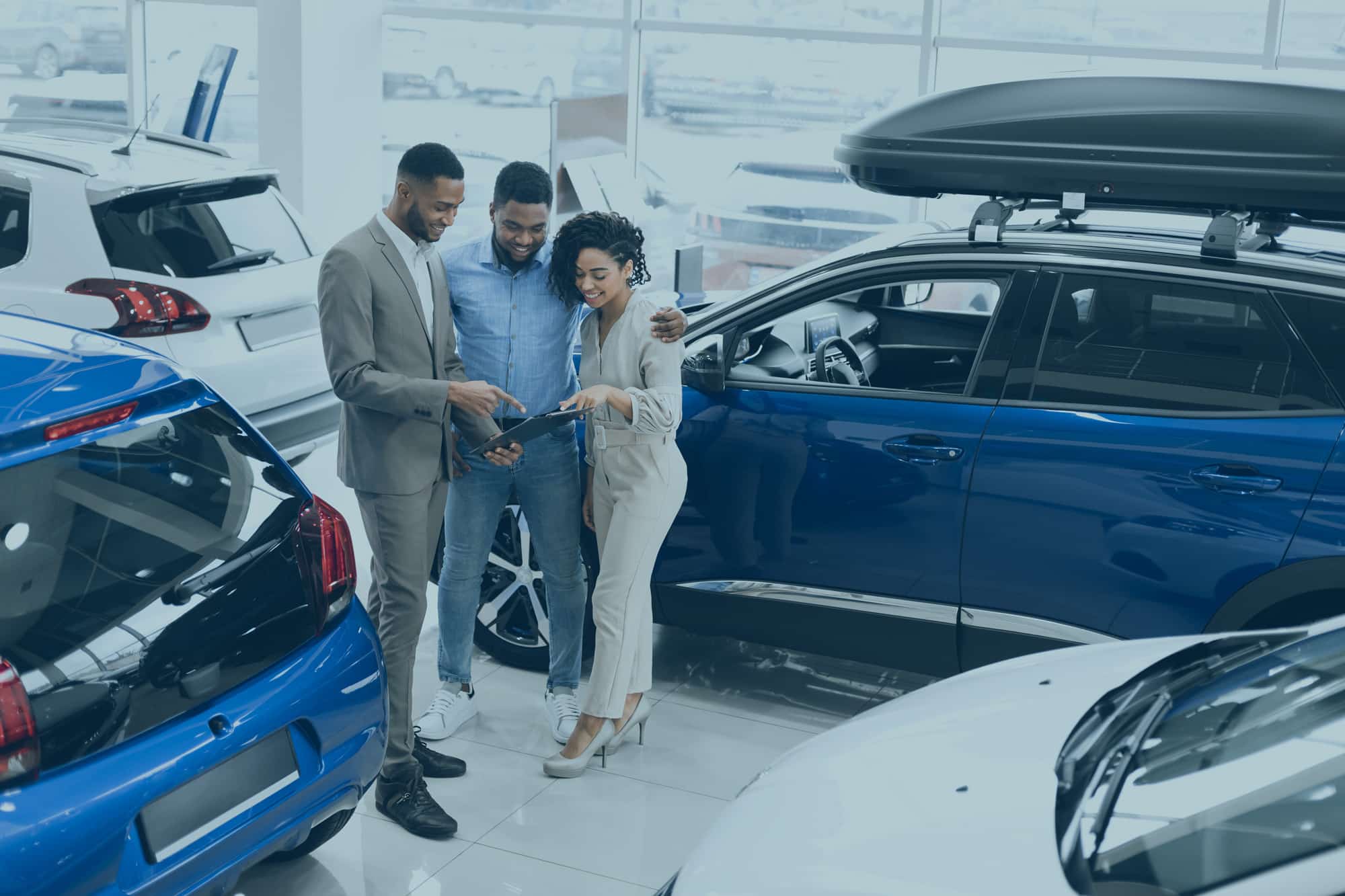 Couple at dealership with sales person